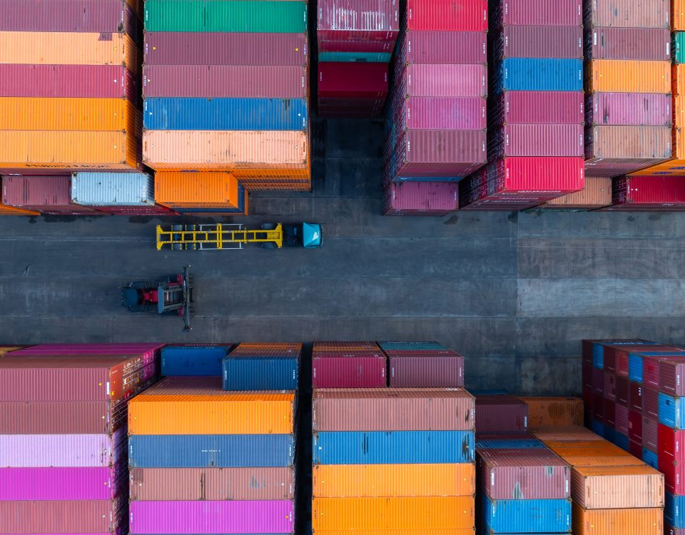 Stacked cargo containers for international shipping and 3PL logistics services