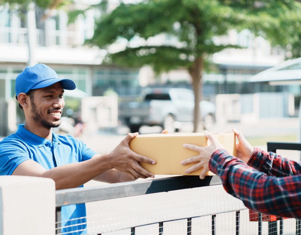 Last mile delivery service with courier handing package to customer